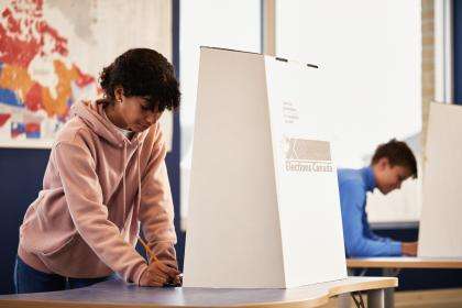Two students voting in mock election