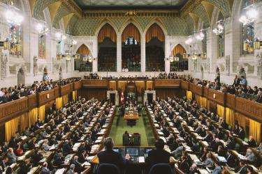 House of Commons of Canada. All seats are taken, the house is full. 