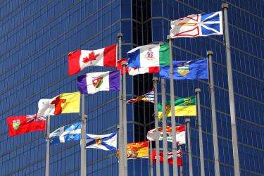 The Canadian flag surrounded by the flags of each province