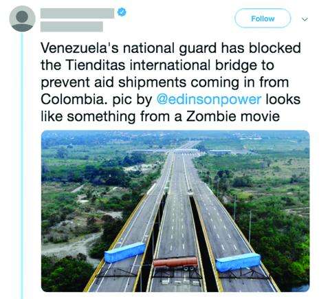 Tweet: Venezuela's national guard has blocked the Tienditas international bridge to prevent aid shipments coming in from Colombia. pic by @edisonpower looks like something from a Zombie movie. Image shows three tractor trailers and barricades across the bridge with no traffic.