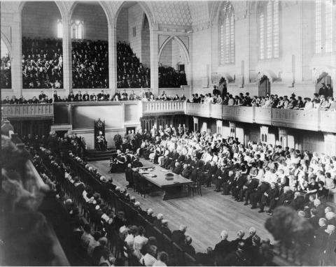 Black and white photo of the House of Commons Chamber during its opening ceremony.
